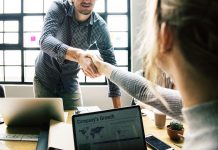 Fiserv acquires and merges with First Data