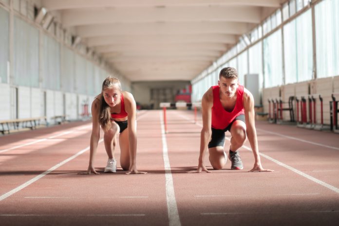 young-athletes-preparing-for-running-in-training-hall-3764014