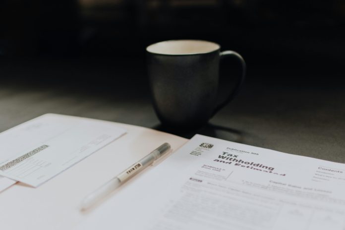kelly-sikkema-wgcUx0kR1ps-unsplash tax